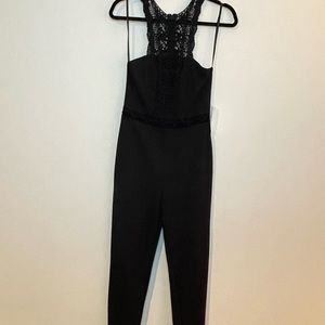 New black sleeveless jumpsuit with lace detail